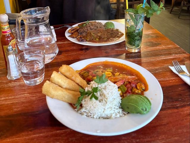 Cazuela de mariscos with rice, avocado and fried cassava